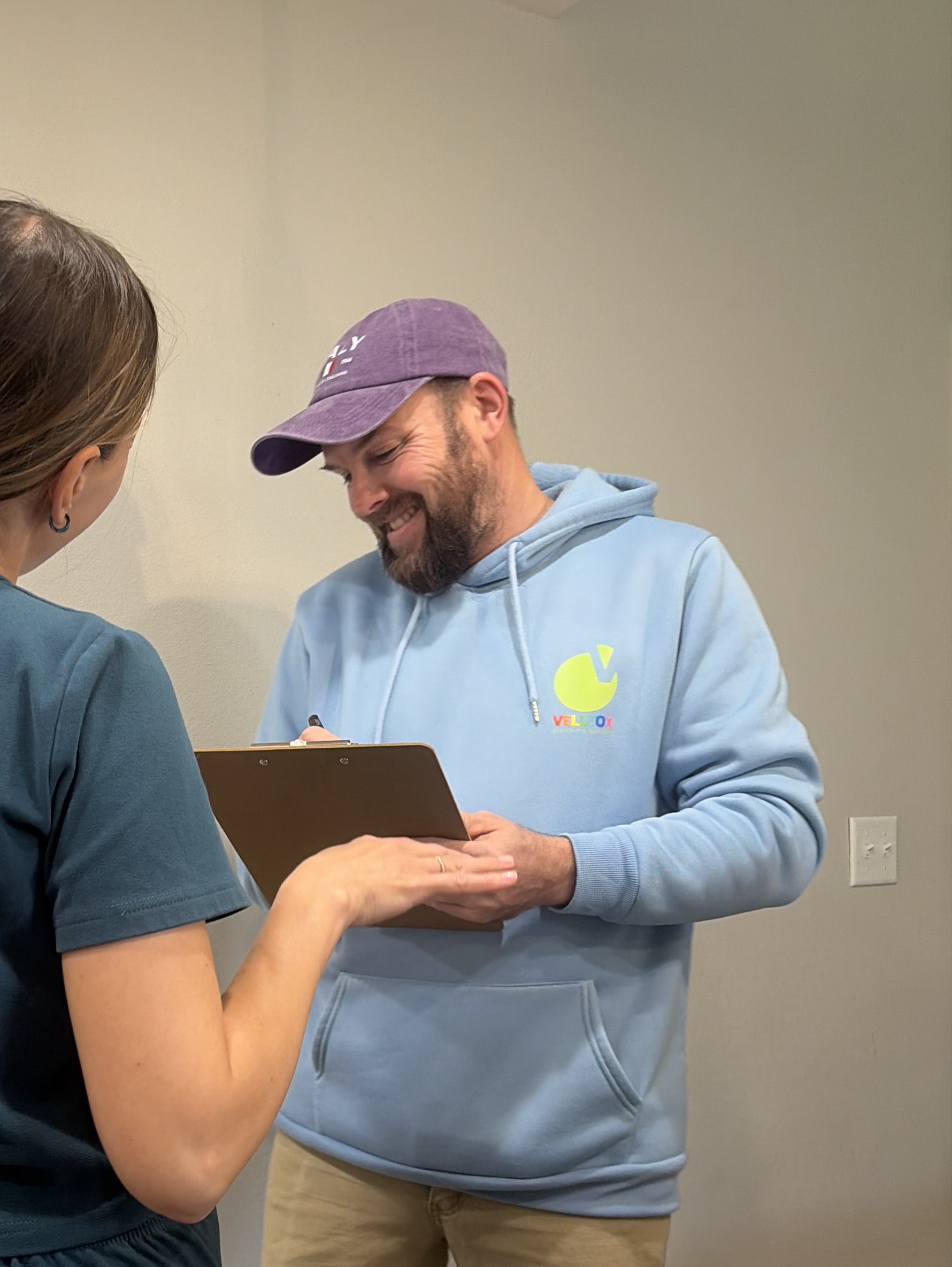 Plumber with customer after service